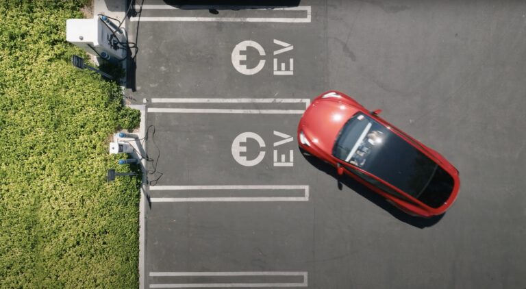Aerial Tesla in EV Carpark _ Wall Street Endeavor