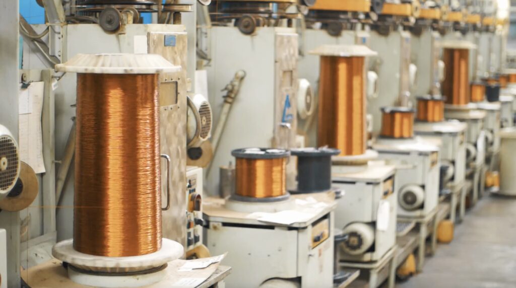 Copper Wire Winding On Coils On Industrial Machines At Factory For Electric Motors