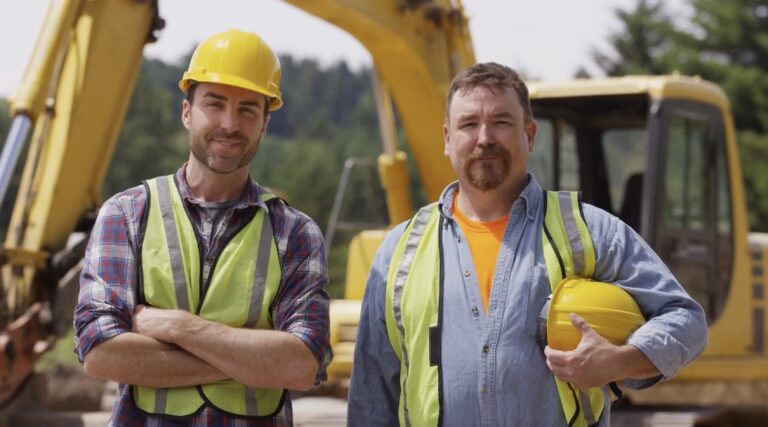 Two Smiling Mine Workers in PPE